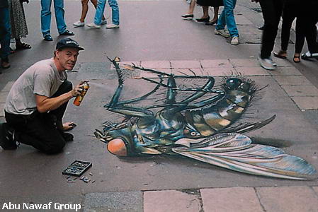 he is drawing on the floor